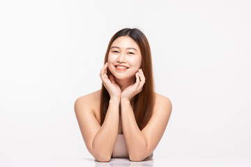 Beautiful Attractive Charming Asian young woman smile with white teeth and touching soft cheek feeling so happy and cheerful with healthy skin,isolated on white background,Beauty Cosmetology Concept