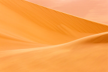 Fototapeta na wymiar Desert Sahara with beautiful lines and colors at sunrise. Merzouga, Morocco