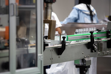 Plastic Bottle on the conveyor in factory production