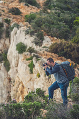 Tourist photographing Navagio Beach and Shipwreck Cove