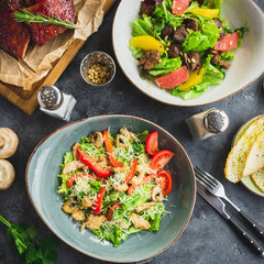Grilled ribs with buckwheat, salad with citrus and grilled chicken, salad with tomato