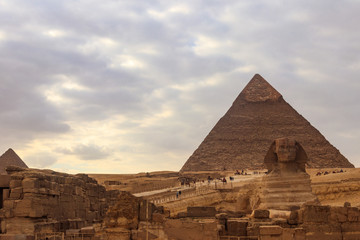 Fototapeta na wymiar Egyptian Great Sphinx and pyramids of Giza in Cairo, Egypt