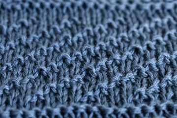Blue crocheted texture. Ready for your design.  Background from gentle blue jersey close-up. knitted fabric texture