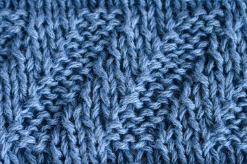 Knitting diagonal pattern of natural blue wool