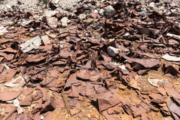 Metal straps trash and rusty tin cans from Ludwig mine in the desert
