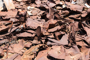 Metal straps trash and rusty tin cans from Ludwig mine in the desert