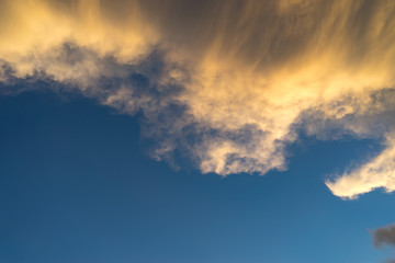 Natural background with clouds at sunset.
