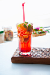 Fresh fruit lemonade with mint in a glass