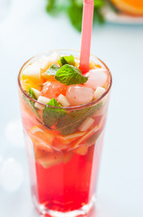 Fresh fruit lemonade with mint in a glass