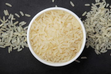 A glass bowl with white long-grain rice