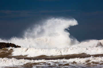 Big waves on a sea with blue background in Essaouira, Morocco.