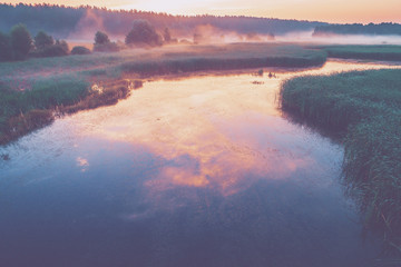 The magical sunrise over the lake. Rural landscape