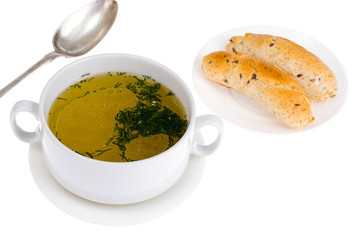 Hot meat broth with fresh cereal bun.