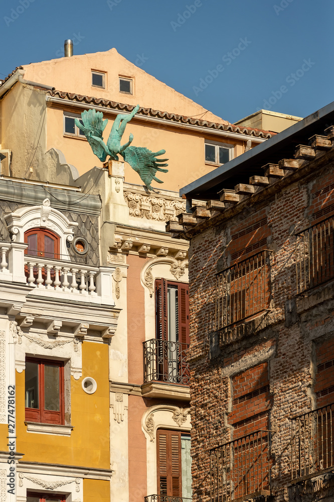 Wall mural madrid, spain. air accident. the sculpture of angel on the roof of the house, the sculptor miguel an