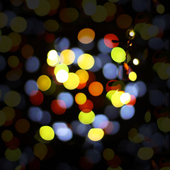 Obraz premium Christmas and happy new year on a blurred bokeh. Glare blurred blank background.