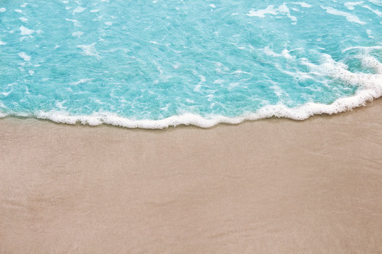 Colorful Light Blue Wave On Sandy Shore Nature Sea Background