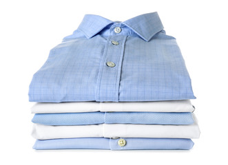 Stack of clean clothes on white background