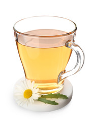 Cup of hot chamomile tea on white background