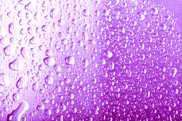 Drops of water on a color background. Gray. Shallow depth of field. Selective focus. Blur.