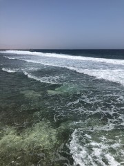 waves breaking on the rocks