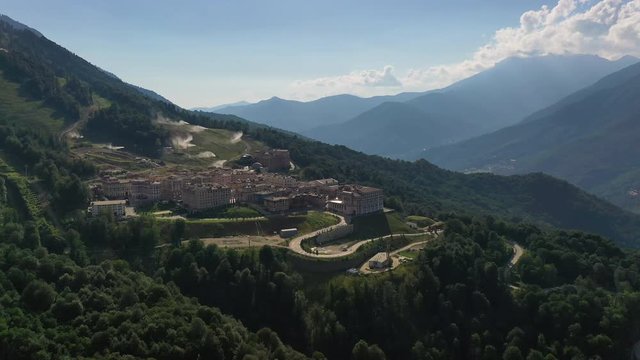 Aerial video shooting. The hotel is in the mountains. Outdoor recreation. No people. Krasnaya Polyana, Sochi. The Gorki Gorod panorama.