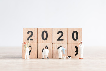 Miniature worker team painted number 2020 and remove number 2019  , Happy new year 2019 concept