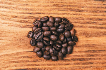 A cup of coffee and scattered coffee beans. Layout. Flat lay. Coffee bean.