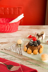 Christmas Tiramisu with biscuits, blackberries and cherry on top