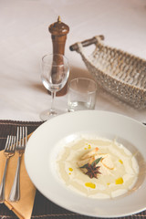 Smashed Potatoes in white plate and star anice