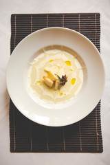 Smashed Potatoes in white plate and star anice