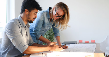 Obraz premium Coworkers working at business office and using tablet