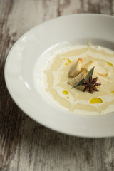 Smashed Potatoes in white plate and star anice