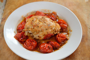 Close up of Fried chicken fillet with garnish of tomato
