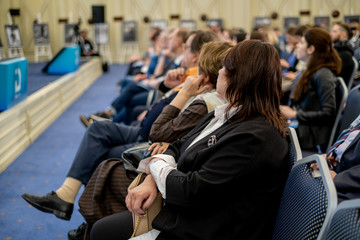 Audience listens to the lecturer at the conference