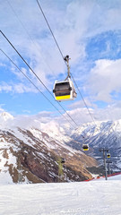 Fototapeta na wymiar Cable car cabin at beautiful slopes of the Caucasus Mountains, Elbrus