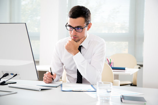 Serious Businessman Working With Computer