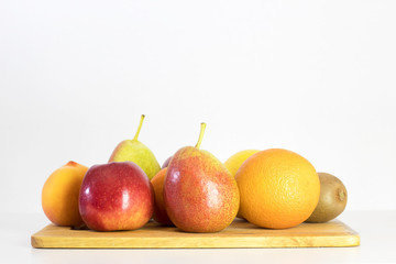 Naklejka na ściany i meble red Apple, pear, lemon, orange, kiwi, peach on white background, copy space