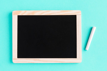Blackboard with chalk on colored surface