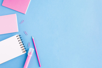 Several notebooks on blue surface