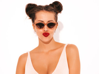 Closeup portrait.Young beautiful sexy hipster woman with red lips in sunglasses.Trendy girl in summer swimwear bathing suit. Positive female makes duck face.Funny model isolated on white.Two horns