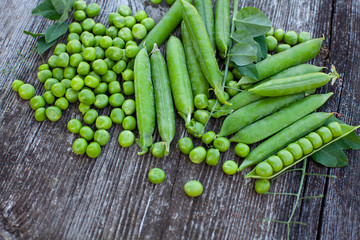 fresh pea on dark wooden surface