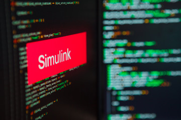 Programming language, Simulink inscription on the background of computer code.