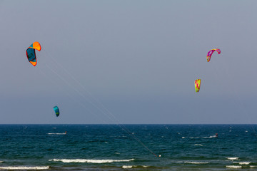 Panoramic view of Deveses beach in Denia with some surf kites in the sky