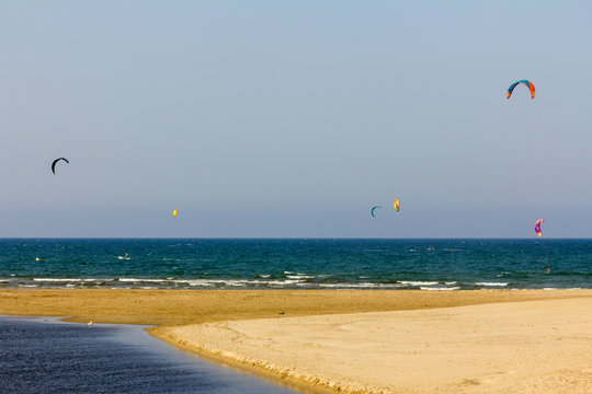 Panoramic view of Deveses beach in Denia with some surf kites in the sky