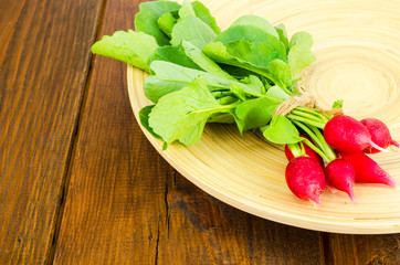 Fresh farmer bio radish on wooden plate. 