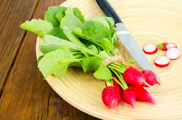 Fresh farmer bio radish on wooden plate. 