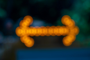 Yellow color abstract bokeh lights  background.Blurred arrow lighting background.