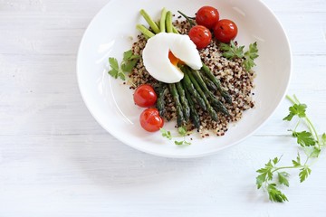 Quinoa with green asparagus, Poached Egg and grilled tomatoes. 