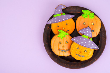 Bright Halloween pumpkin shaped gingerbread cookies.