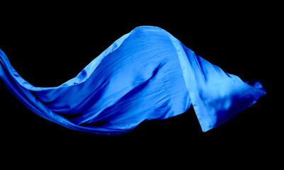 Smooth elegant blue transparent cloth isolated on black background.